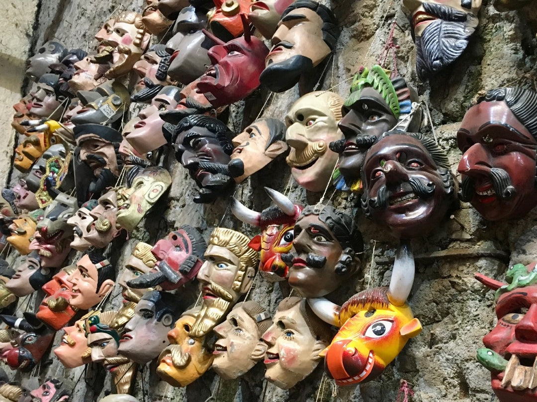 Artisan masks at a market in Antigua, Guatemala
